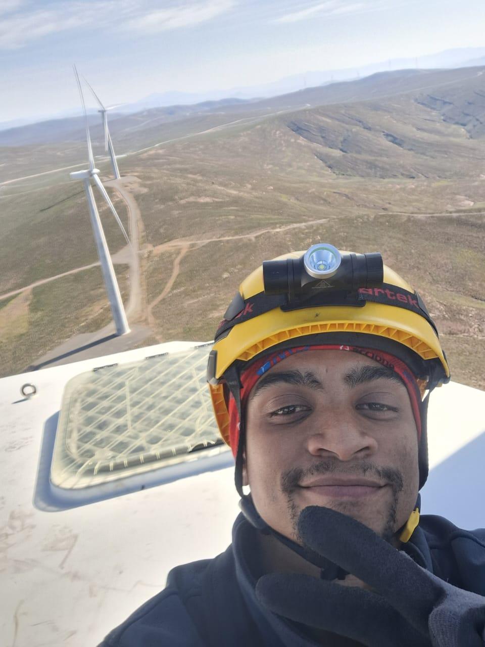 Previous intern (from the first intake), Aidan Swartz atop a wind turbine at Roggeveld Wind Farm