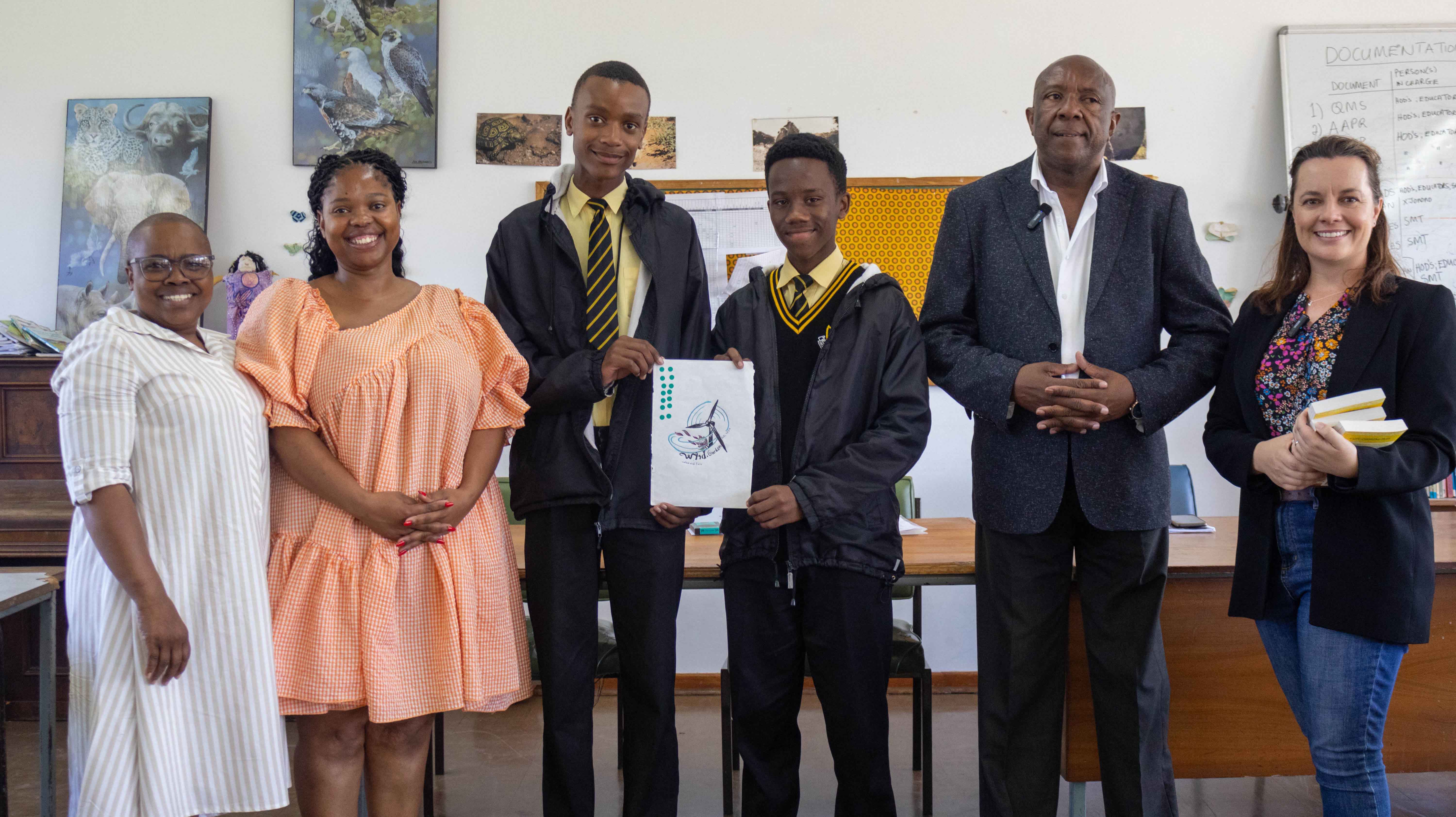From left to right: Principal of Nombulelo Secondary School, Mrs N.B. Mhlekwa; Ms. Sibulele Qodashe; Amandla Wayi; Mivuyo Ngetu; CMC Head Mr M.B. Matyolo; Angela Harrison, SED Manager, Wind Garden. Absent: Nanga Onele, third Nombulelo Secondary School winner.